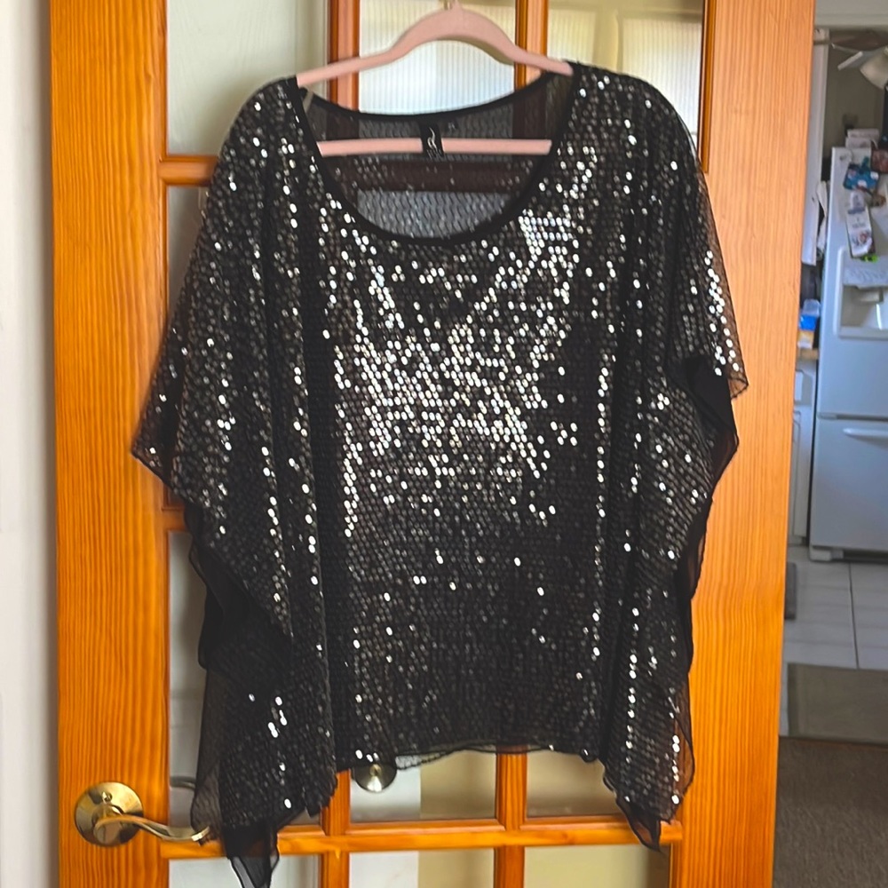 Sequins black top with sheer base.